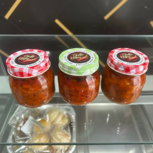 Fresh homemade Kerala pickles - Mango, Garlic, and Lemon pickle jars at Chilli Flakes London Ontario